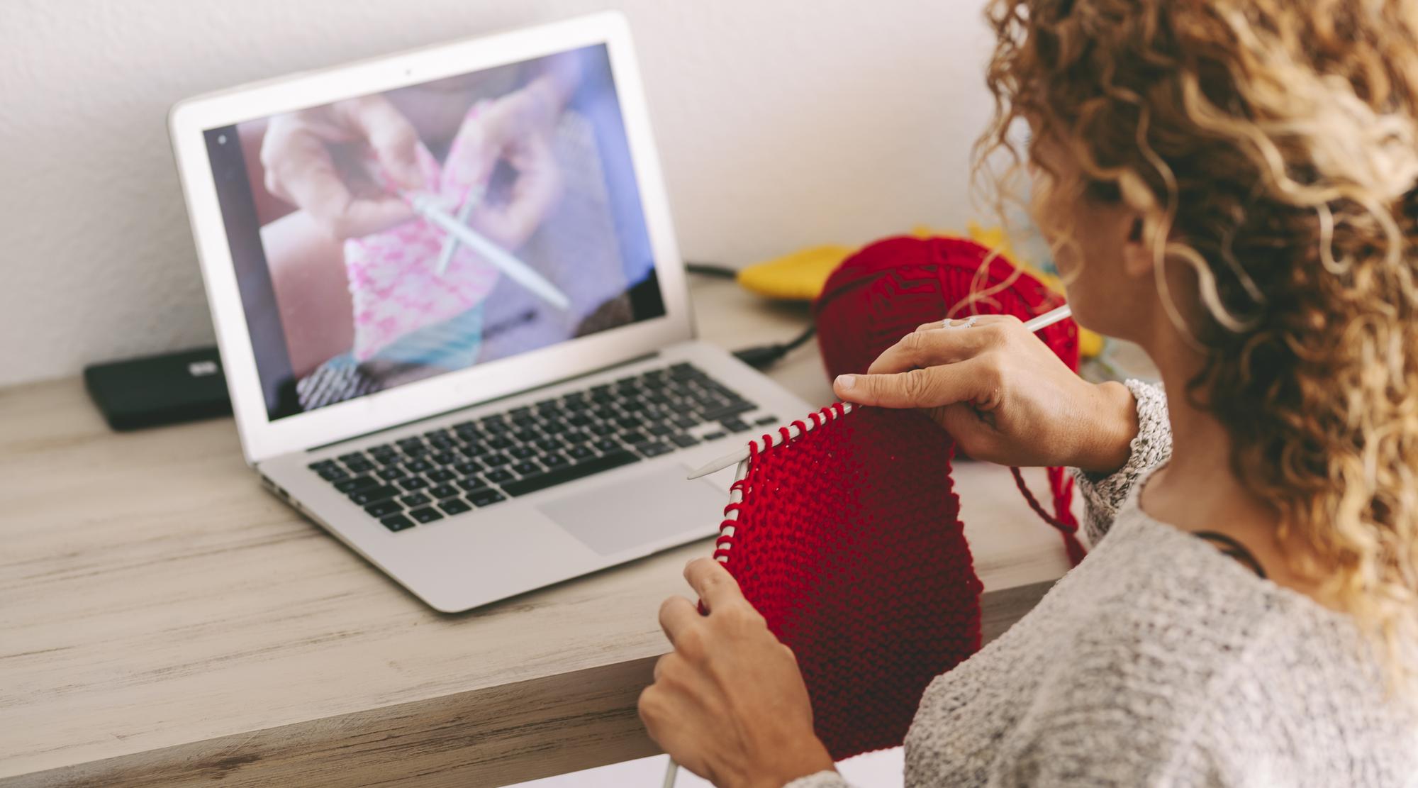 Instructor demonstrating embroidery stitch